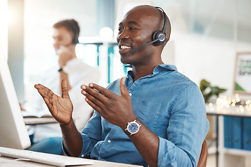 Image showing Call center, telemarketing and customer service with a business man working in an office and consulting on a headset. Help, crm and contact us with a black male consult at work on a computer