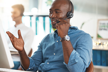 Image showing Black businessman call center conversation in office, working at help desk online telemarketing company. Customer service support, consultant talking on microphone and career success to contact us