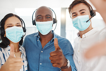 Image showing Selfie of covid call center people with thumbs up in face mask for trust, success and thank you company portrait. Diversity telemarketing or customer service agent team for motivation in corona virus