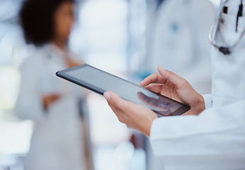 Image showing Medical, healthcare and insurance with a tablet in the hands of a doctor working in a hospital. Medicine, report and technology with a health professional at work in a clinic for care and wellness