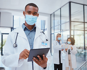 Image showing Portrait of doctor with mask and tablet during covid for bacteria, medicine or corona virus research. Safety, protection and black medical healthcare worker or hospital employee doing telehealth work