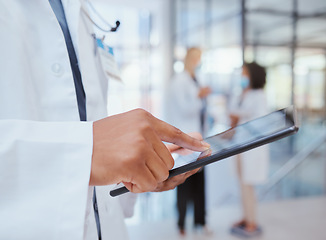 Image showing Man hands of hospital doctor with tablet to search through digital medicine clinic medical records, files or documents. Professional healthcare worker, employee or surgeon doing information research