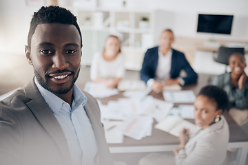 Image showing Presentation, black man and finance meeting with a group of business people. Leader, vision and African speaker or presenter with executive audience in boardroom working on corporate data strategy.