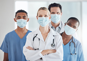 Image showing Covid 19, face mask and woman doctor with nurses teamwork in hospital compliance in stop of global virus. Healthcare leadership, medical and diversity collaboration in security wellness medicine room