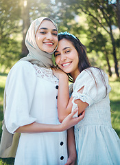 Image showing Women happy in garden, forest park with trees and outdoor garden picnic in multicultural summer fashion. Portrait of female friends together, muslim girl in islamic hijab scarf smile and hug friend