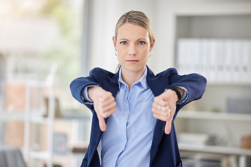 Image showing Business woman, thumbs down and hands in failure, loss or disappointed at work in the office. Portrait of a corporate female employee in disagreement, reject or disapproval gesture at the workplace