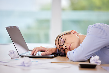 Image showing Business woman sleeping at laptop desk, burnout stress from fatigue and insomnia problem in workplace career at computer. Office worker tired, risk job loss and overworked person nap at tech company