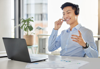 Image showing Customer service, call center and telemarketing with an asian man consultant working on a laptop with a headset. Contact us, crm and consulting with a male working in his sales office with a smile