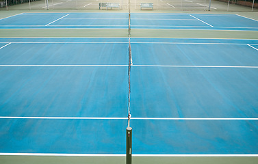 Image showing Empty tennis, court and sports space ready for exercise, training and game workout with mockup. Fitness, cardio and isolated sport match area for to play with a light at night and mock up area