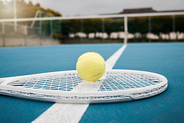 Image showing Tennis and ball with racket with equipment on sports court for fitness, exercise and recreation. Health, competition and training for a tournament match or game. Hobby, objects and healthy lifestyle