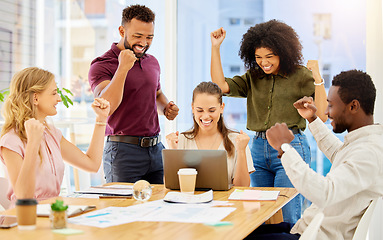 Image showing Happy team celebrate success, sales target business meeting with laptop and staff teamwork goal achievement. Young casual people smile, group working collaboration and company pride in victory fist