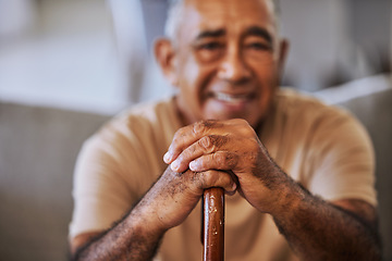 Image showing Portrait of a happy, kind black senior man hands with wrinkles, holding a walking stick and smiling in a retirement home sitting on outside relaxing and waiting in the queue