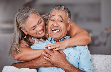 Image showing Happy senior couple, hug and care in love for relationship bonding together relaxing at home. Joyful elderly man and woman smile in hope for loving and hugging happiness in retirement house on sofa