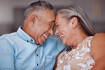 Image showing Love, laugh and happy elderly couple relax and bond in a living room, laughing and sharing a funny joke in their home together. Family, humour and senior man and woman embrace and enjoy retirement