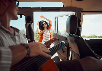 Image showing Dance, van and music with woman dancing and bonding with man in a rv, relax, happy and hipster lifestyle. Freedom, love and couple travel in nature, stop to enjoy the view and guitar celebration