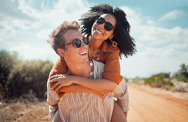 Image showing Love, happy and couple piggy back on road path in Arizona desert in USA for romantic getaway. Interracial people dating smile while enjoying summer romance on travel holiday adventure together.