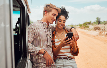 Image showing Car, phone and couple on a road trip in summer on holiday to enjoy traveling and sharing social media news. Nature, interracial and happy woman searching on gps map with calm partner on a vacation