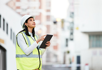 Image showing Woman, building manager and construction on tablet doing inspection and working on site in the city. Female architect or builder contractor checking architecture at work on touchscreen technology