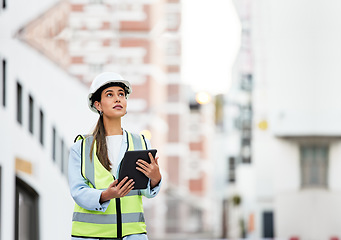 Image showing Woman, building and construction inspection on tablet working on site in the city for industry. Female architect, builder or contractor checking architecture detail at work on touchscreen technology