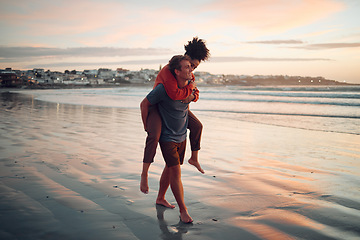 Image showing Love, travel and couple walking along the beach at sunset, bond and having fun in nature together. Freedom, carry and man and woman enjoying a romantic ocean holiday in Los angeles, cheerful and calm