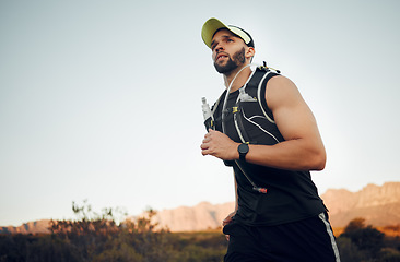 Image showing Health, man runner and in nature for wellness, training and fitness with sportswear being focus. Exercise, young male athlete and running outdoor for healthy, cardio and workout warm up and fresh air