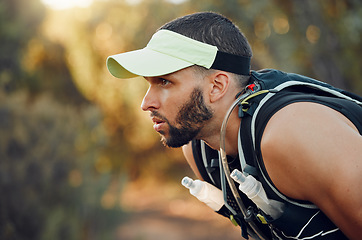 Image showing Thinking, focus and outdoor running man challenge, breathing and tired from fitness trail in Australia. Sports athlete nature hiking, training and mental motivation with strong mindset for wellness