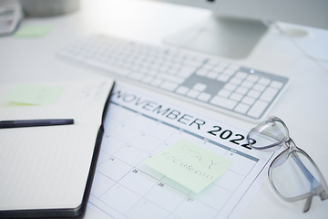 Image showing Calendar, schedule and management of a working business person planning goals and priorities at a table. Time, event and list for worker plan agenda and strategy for effective multitasking reminder