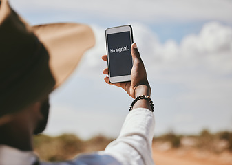 Image showing Black man, phone and lost network signal in nature environment, safari landscape and wild location. Hands, 5g mobile technology or gps travel map app in national park help search for confused tourist