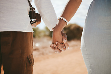 Image showing Hand holding, couple and black people travel together on a road trip ready for a safari holiday. Support, trust and vacation love of people hands united in nature in the summer sunshine