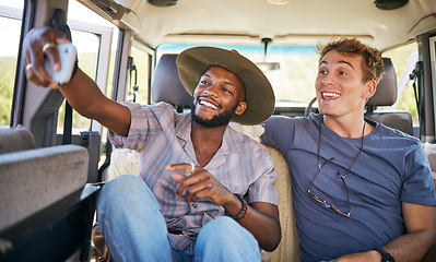 Image showing Travel, friends and selfie on a phone by men on a road trip, bonding on a backseat while driving in a vehicle. Freedom, relax and happy black man taking photo with friend on their journey together