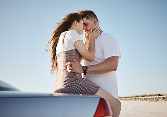 Image showing Car, love and couple on a road trip in summer on a holiday vacation for bonding, romance and romantic honeymoon. Travel, freedom and young woman holding her partner outdoors enjoying their weekend