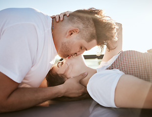 Image showing Love, intimacy and couple kiss and relax together outdoor, touching lips and having fun. Romance, flirting and affection by young man and woman showing desire and passion while kissing outside