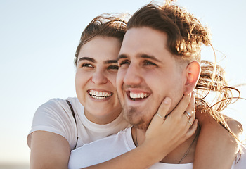 Image showing Love, couple and being happy while smile, relax and embrace with bonding, joyful or romantic hug. Real relationship, young man and woman celebrating loving and on holiday or vacation together