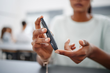 Image showing Diabetes, finger and black woman with blood sugar test on to check levels of student while sitting at desk. Healthcare, health and female prick to use glucose meter for insulin and wellness