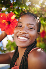 Image showing Summer flower, sunshine and black woman facial beauty care. Happiness, inner beauty and natural happy glow or smile on relaxing, wellness and self care vacation near Hibiscus plant tree