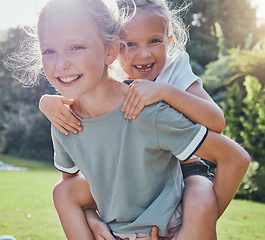 Image showing Children, smile and sister piggy back girl outdoor being playful, happy or relax together for summer holiday. Siblings, sisters and playing excited on grass, kids have fun and enjoy play date or game