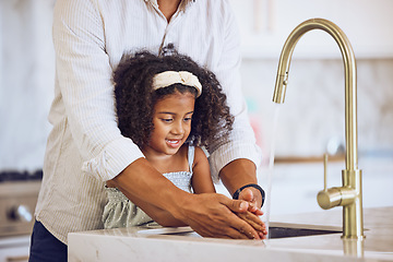 Image showing Girl, hands and dad for washing, cleaning and hygiene in kitchen in house. Child, water and father together learning to wash hand to stop germs, bacteria and virus for health, wellness and care