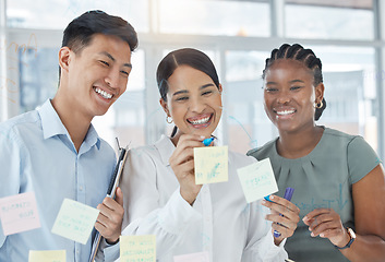 Image showing Teamwork, planning and sticky note meeting with business people writing on window for scrum marketing strategy, collaboration or goals. Vision, innovation and management with employee working on idea