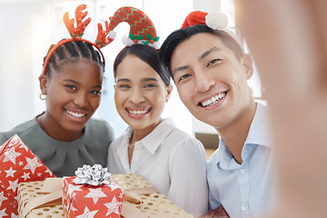 Image showing Christmas, selfie and business people with gift for giving, love and celebration with holiday office party or workplace culture and diversity. Corporate staff in portrait pov picture with present box