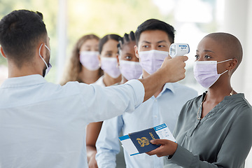 Image showing Covid, passport and travel with black woman and security with thermometer check for healthcare, safety or vaccine certificate. Innovation, vacation and face mask with group of people in airport queue