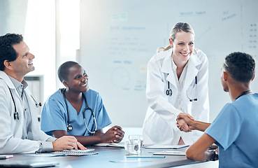 Image showing Handshake, doctors meeting or diversity team happy for partnership, hospital onboarding or promotion of nurse employee. Medical interview success, thank you and welcome from hiring healthcare manager