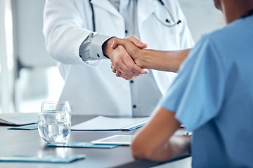 Image showing Doctor handshake, congratulations and nurse at office desk consulting on medical procedure, diagnosis or medical health care contract. Thank you, well done or welcome to the hospital cardiology team