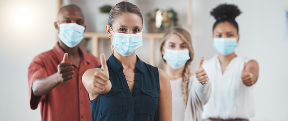 Image showing Thumbs up, covid pandemic and staff with mask in business show a positive attitude in workplace. Coronavirus epidemic, employees health and safety policy in office of advertising or marketing company