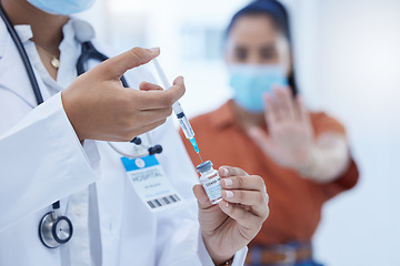 Image showing Doctor with covid vaccine, injection and corona medicine needle, bottle and syringe in hospital. Zoom in nurse hands, expert healthcare and flu risk, stop vaccination and reject medical treatment