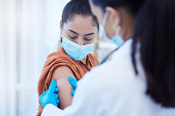 Image showing Covid vaccine, doctor and patient with face mask for safety, compliance and healthcare at a hospital or clinic. Woman with medical worker expert in office consultation for corona virus medicine help