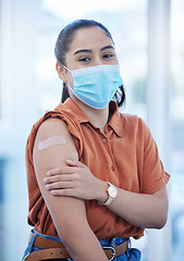 Image showing Covid, vaccine and health with woman and plaster for medical safety, wellness and virus protection. Medicine, patient and face mask with girl and bandage on arm for injection, pandemic and treatment