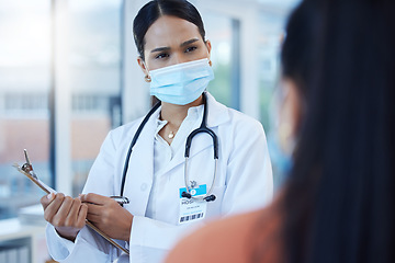 Image showing Covid mask, black woman doctor and medical patient at a hospital or clinic ask a health question. Insurance communication, medicine advice and cardiology consultation of a worker with help documents