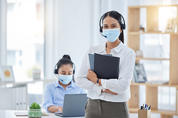 Image showing Covid, receptionist in a mask at office and professional business secretary working through pandemic. Corporate woman employees, during coronavirus epidemic and focus on health or safety at workplace