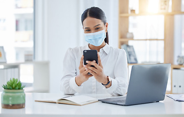 Image showing Covid, mask and business woman on her phone checking her schedule, diary and health news online at the office. Employee, worker searching on social media or reading a safety policy email on internet