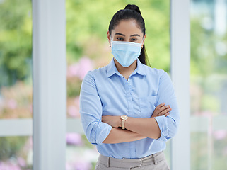 Image showing Covid, face mask and business woman with compliance, safety and company policy motivation in human resources management. Proud corporate manager or hr worker corona virus health portrait in an office